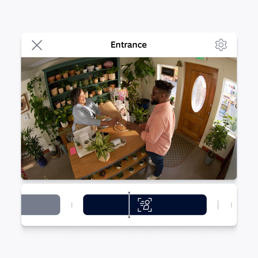A person in a flower shop with Ring app interface below, showing this event on a timeline
